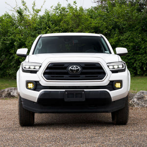 White Toyota Tacoma front end view with Form Lights Sequential LED Projector Headlights (White DRL) for Toyota Tacoma