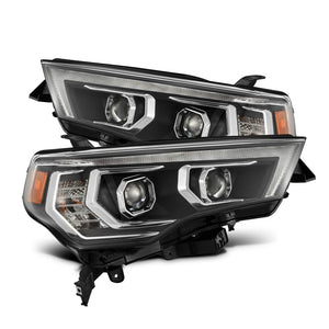Close-up view of AlphaRex MK II LUXX-Series Black LED projector headlights for 2018-2019 Toyota Tacoma.