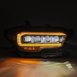 Close-up view of AlphaRex NOVA-Series LED Projector Headlights on Toyota Tacoma (2016-2023) in orange lights