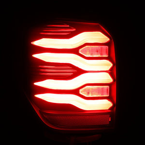 AlphaRex LUXX-Series LED Tail Lights (Black) for Toyota 4Runner in a red light