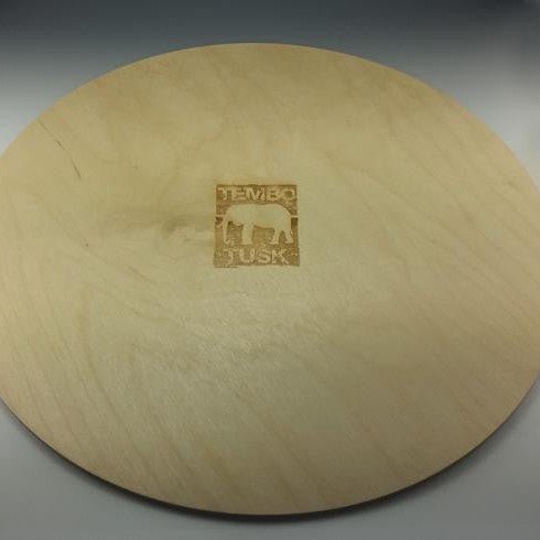 Tembo Tusk Skottle Grill Table Top resting on a Skottle Grill at camp